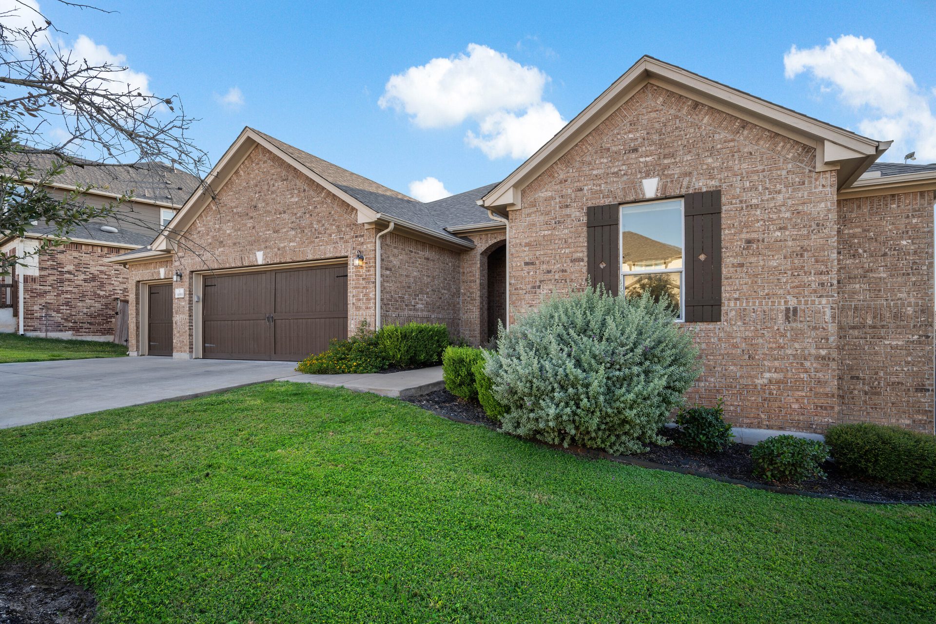 Front exterior of a Central Texas brick and stone home
